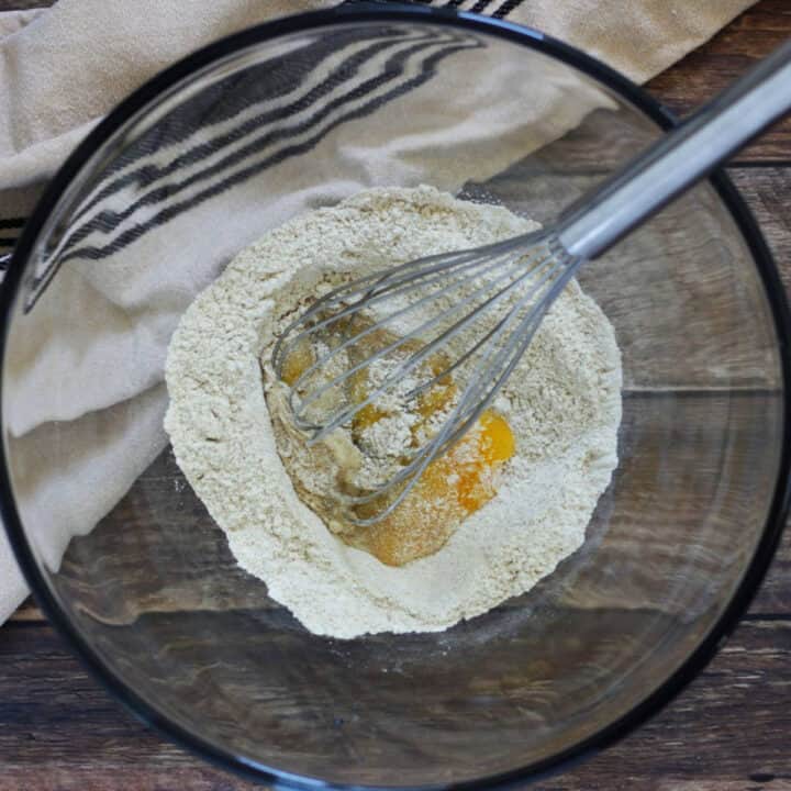 whisk in egg in centre of flour mixture