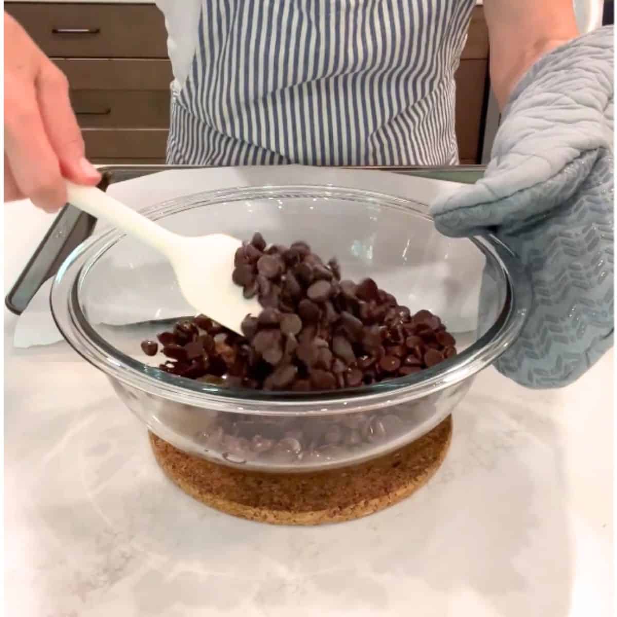 soft, melted chocolate is stirred with nuts.