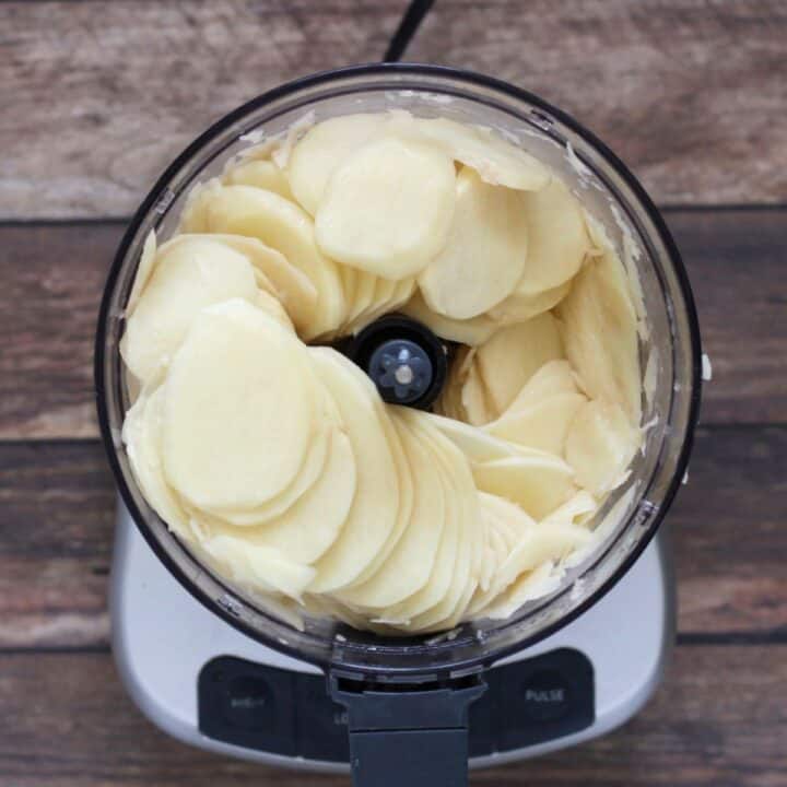 sliced potatoes in food processor.
