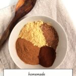 4 spices arranged in a bowl but not mixed together.