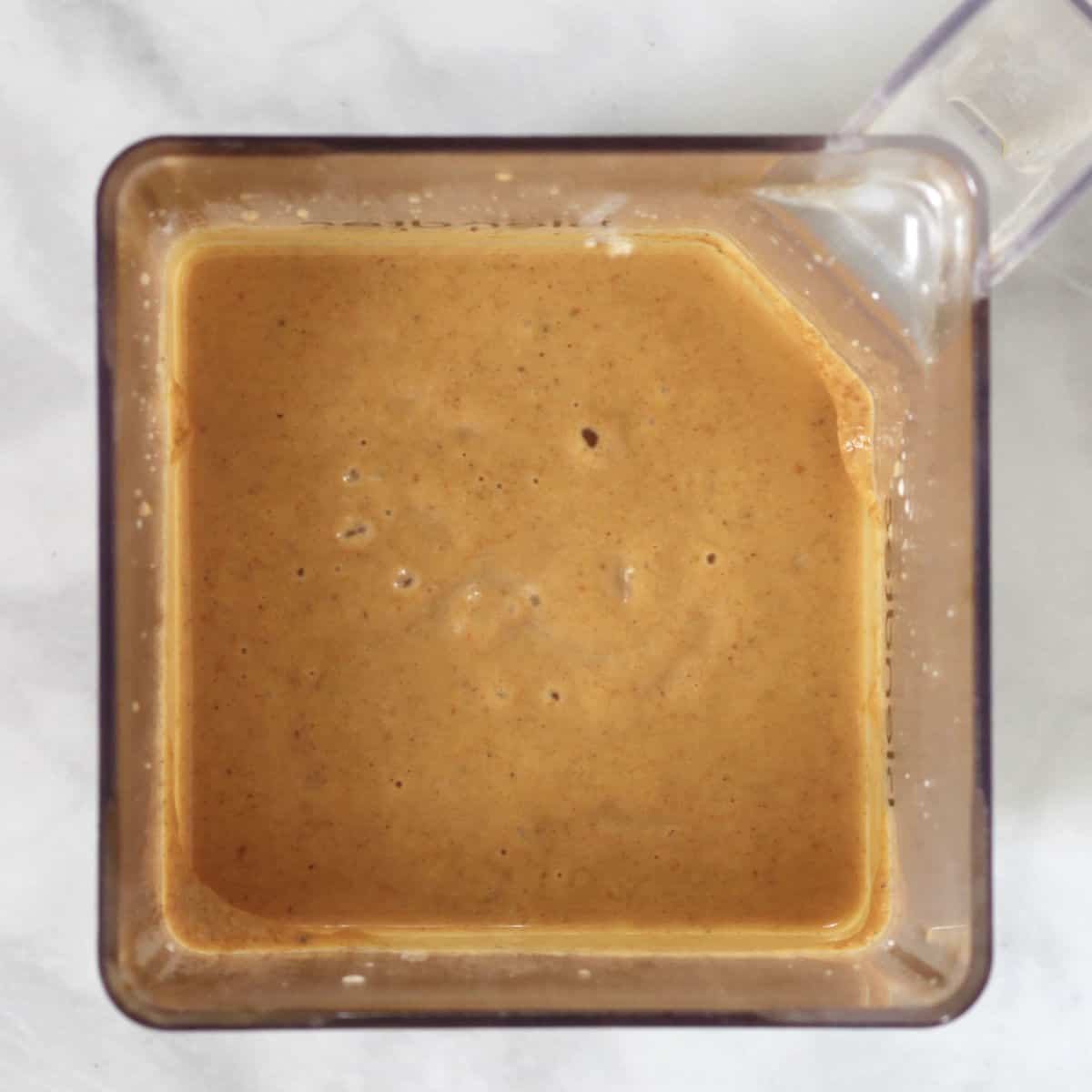 pureed pumpkin pie filling in a blender jar