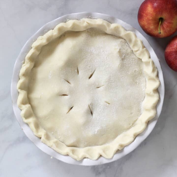 unbaked pie with slits poked in top crust