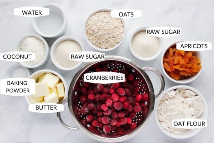 ingredients for cranberry bars in individual bowls with labels