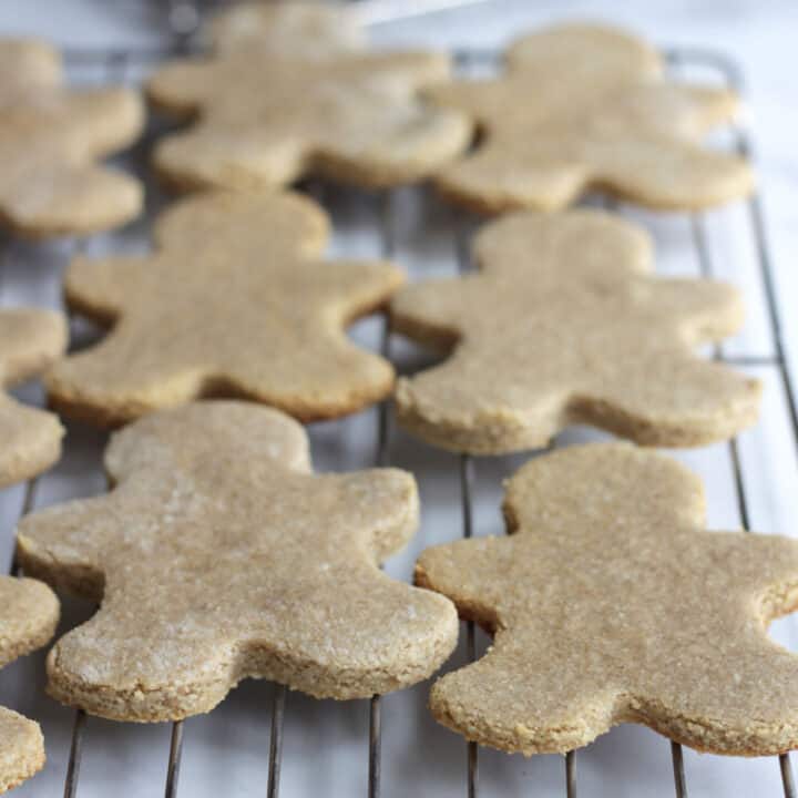 gingerbread men cookies cooling on rack