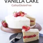 wedge of two-layer vanilla cake filled with red strawberry filling and frosted in white frosting sitting on a black plate with a fork, in front of remaining cake, plus title text, "gluten free Vanilla Cake, CathyGlutenFree".