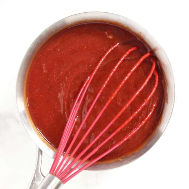 whisk in red tomato sauce in small saucepan