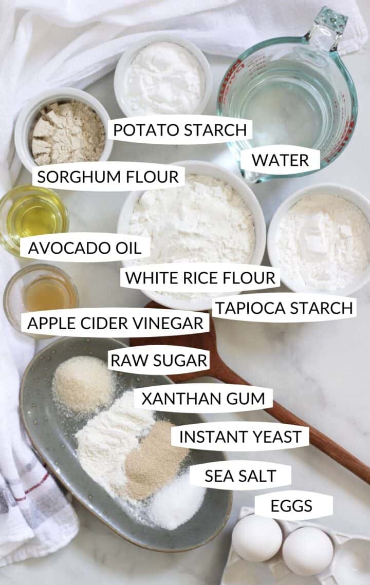 individual ingredients for gluten free dinner rolls in small, individual containers with labels