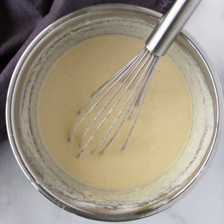 runny batter in bowl with whisk