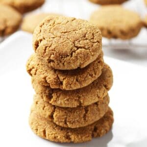 stack of thick, golden cookies on white plate