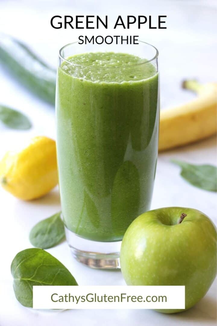 green smoothie in glass surrounded by green apple, banana, lemon, cucumber, and spinach leaves with title text
