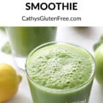 closeup of the foamy green top of a smoothie in a glass
