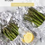 looking down on two foil packets of asparagus spears.