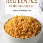 white bowl heaped with golden cooked red lentils with title text.