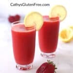 two glasses of deep pink drinks garnished with slices of lemon, whole strawberry in front, and title, "healthy Strawberry Slush - CathysGlutenFree.com"