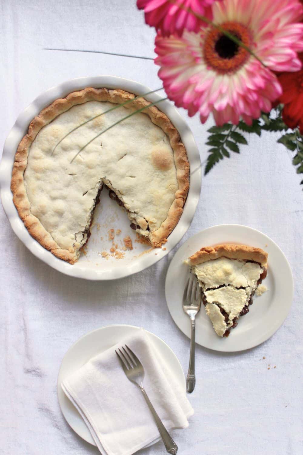 top down view of raisin pie with one slice plated.