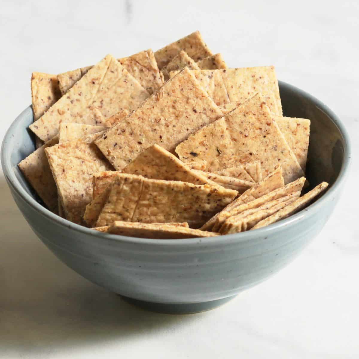 square crackers arranged randomly in bowl.