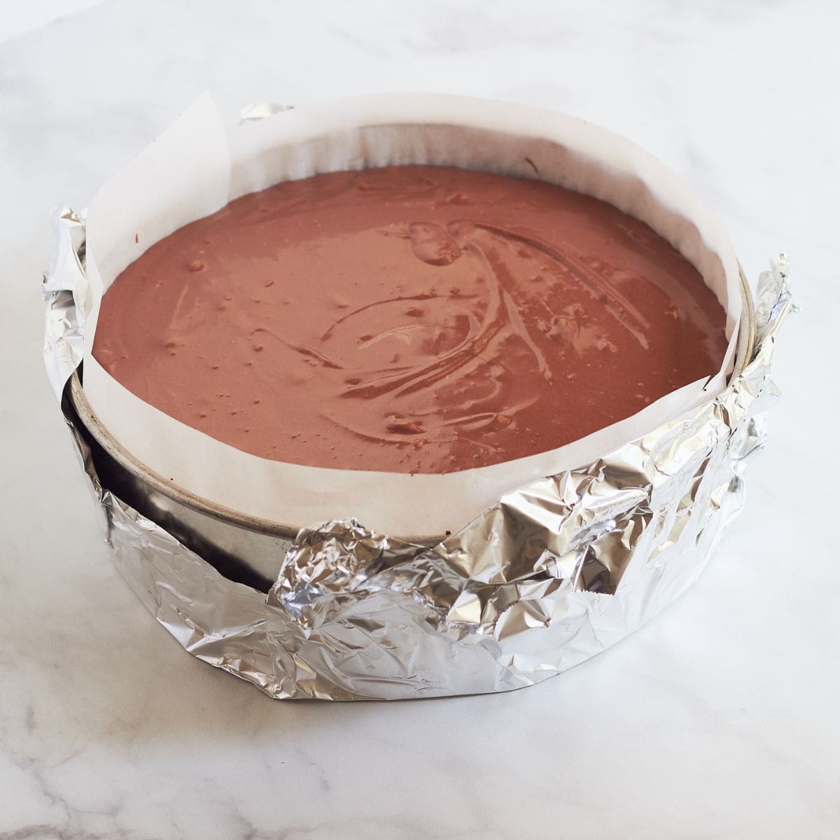 wet chocolate batter poured into prepared crumb crust.