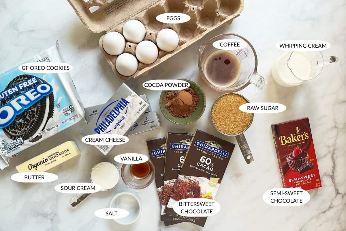 ingredients for gluten-free chocolate cheesecake laid out and labeled.