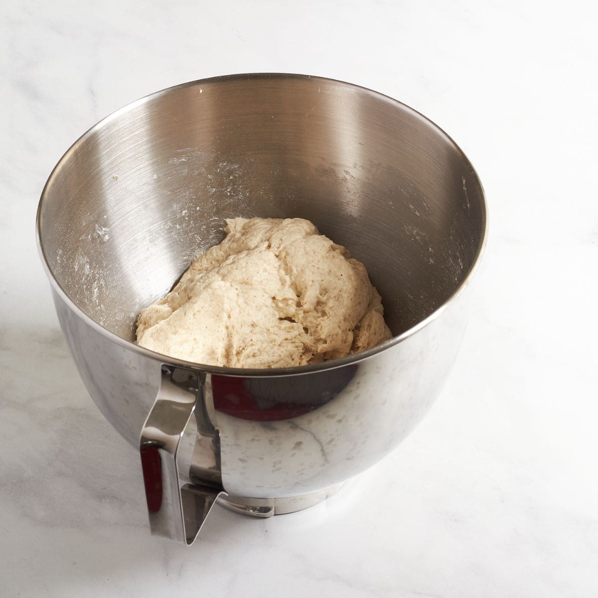 moist ball of dough in mixing bowl.