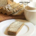 buttered slice of almond loaf with more slices in background.