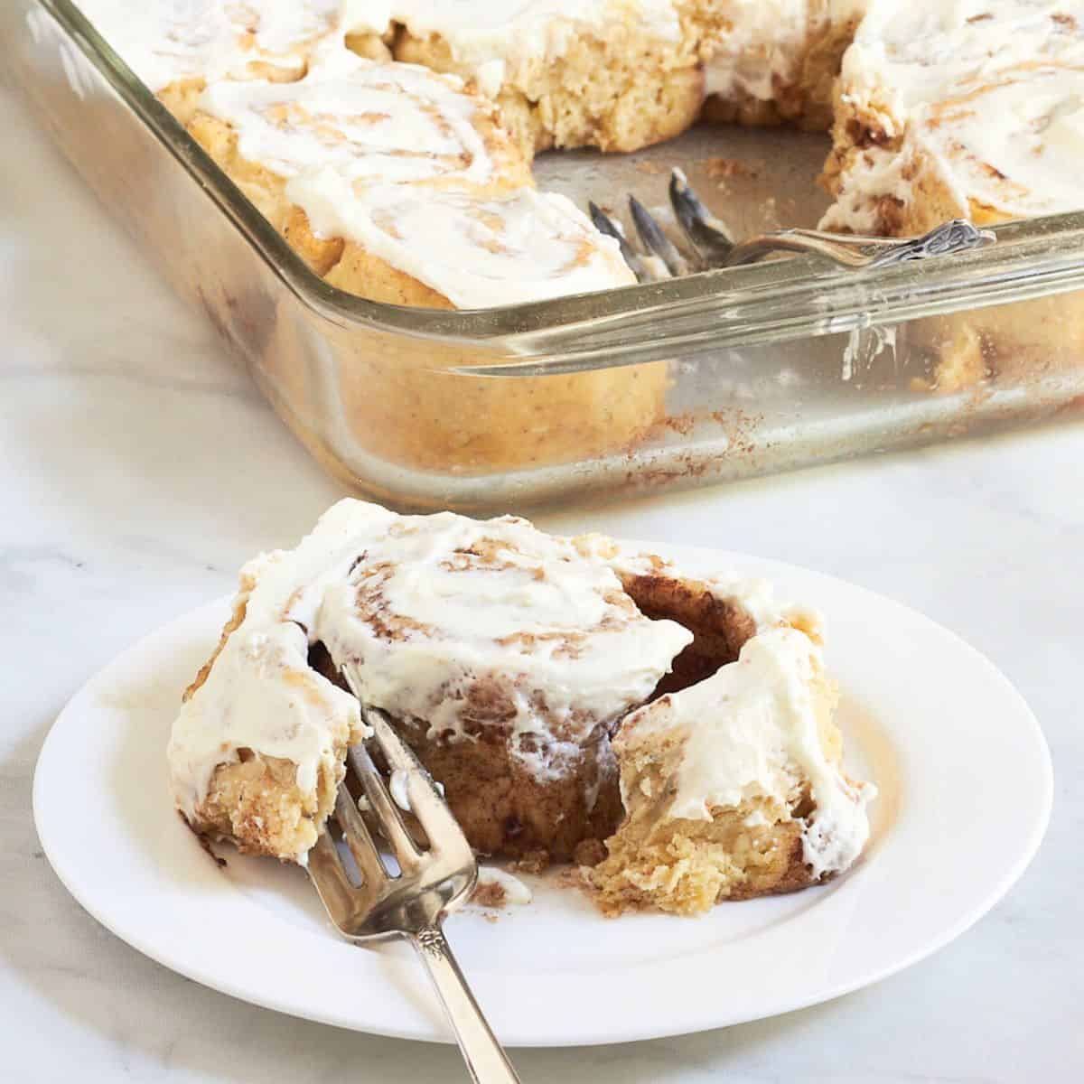 soft, gooey cinnamon roll pulled open with a fork.