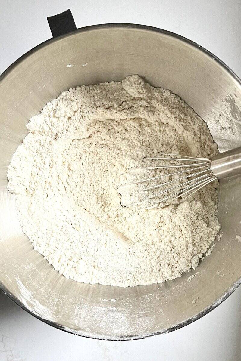 whisk in flour in bowl of stand mixer.