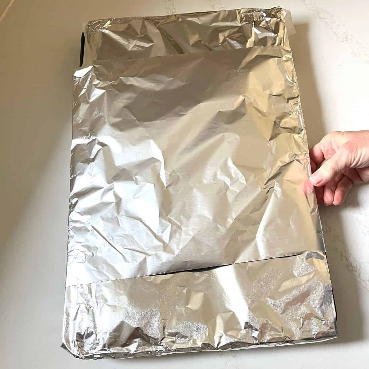aluminum foil wrapped over baking sheet.