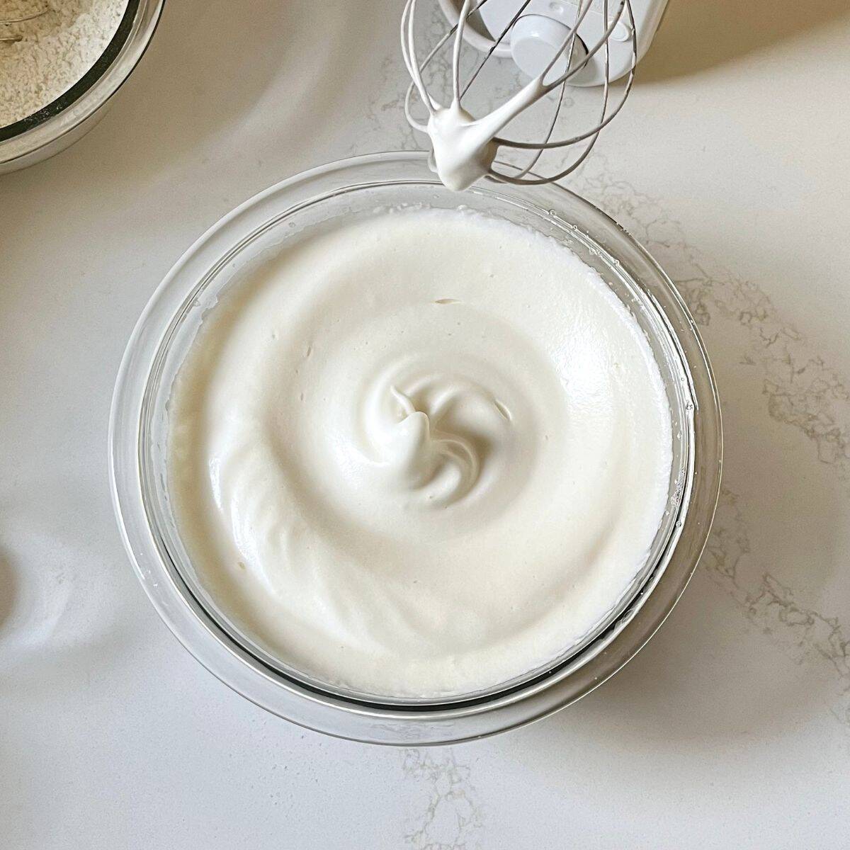 egg whites beaten to soft, glossy peaks.