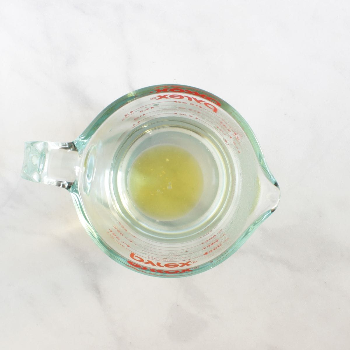 water and oil in measuring cup.