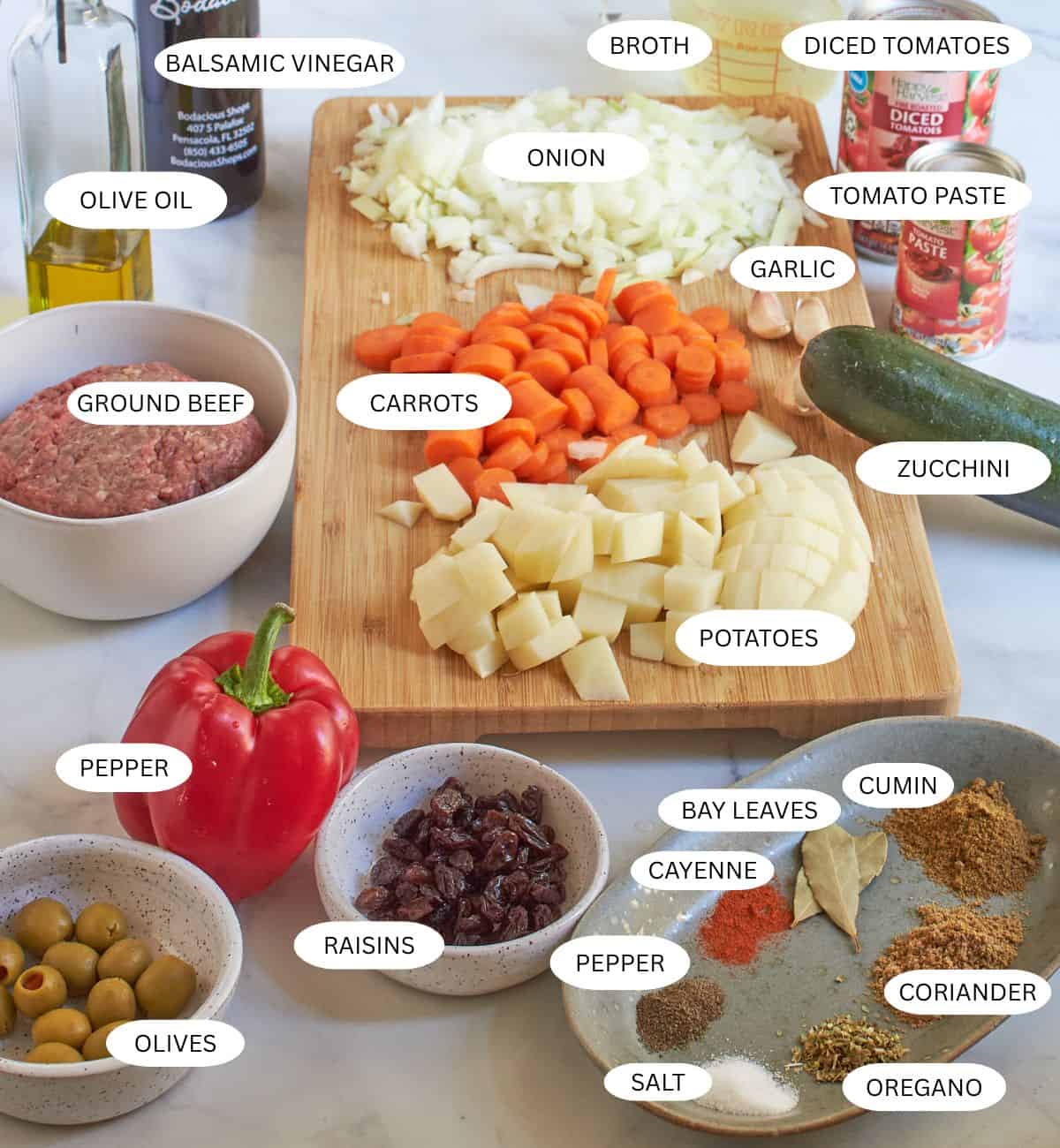 chopped ingredients for cuban picadillo laid out and ready to cook.
