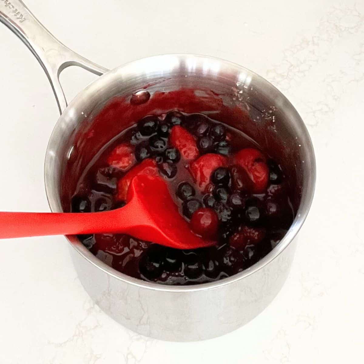 berries cooked in thickened sauce.