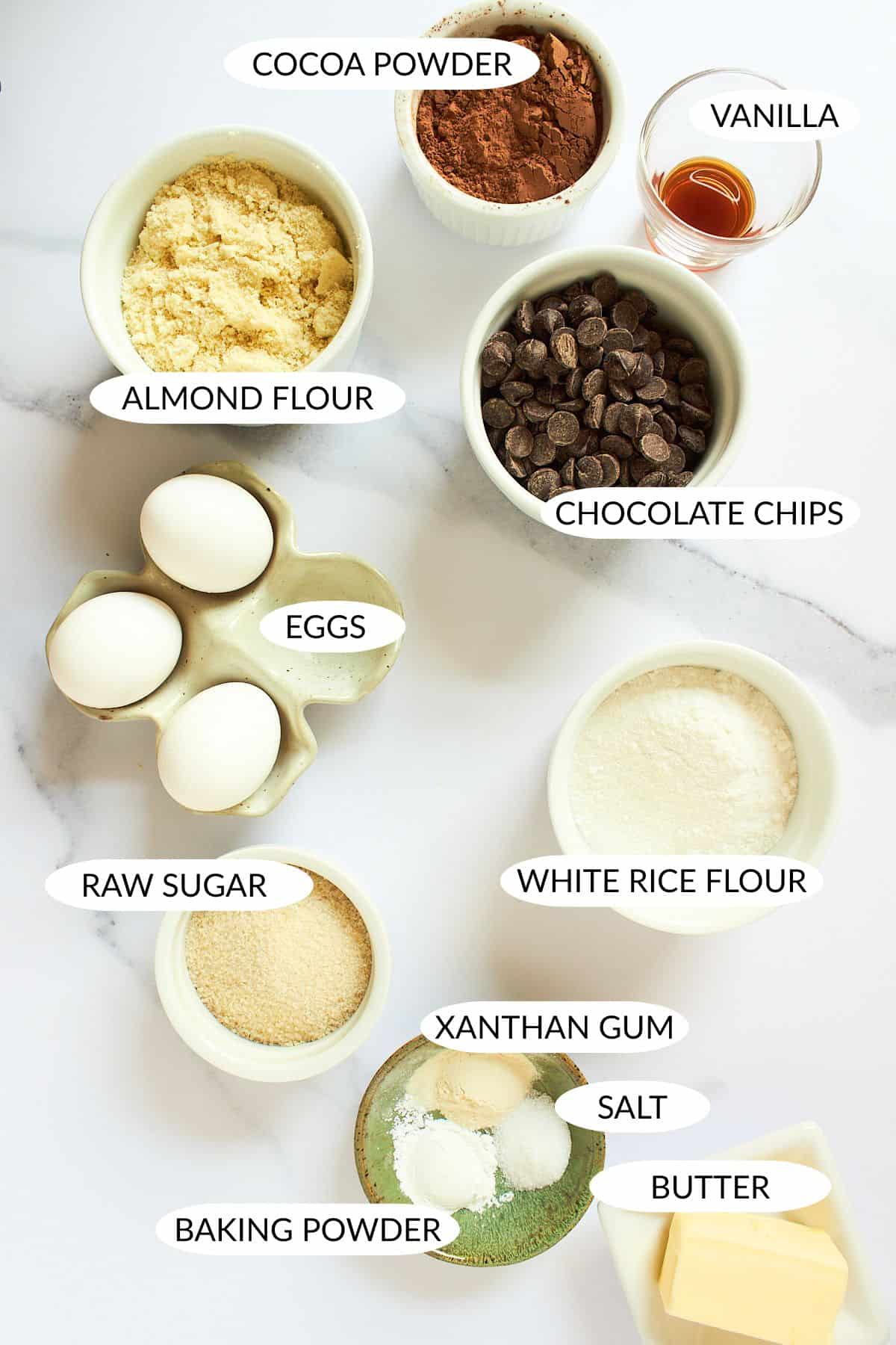 ingredients for gluten free almond flour chocolate biscotti in small bowls with labels.