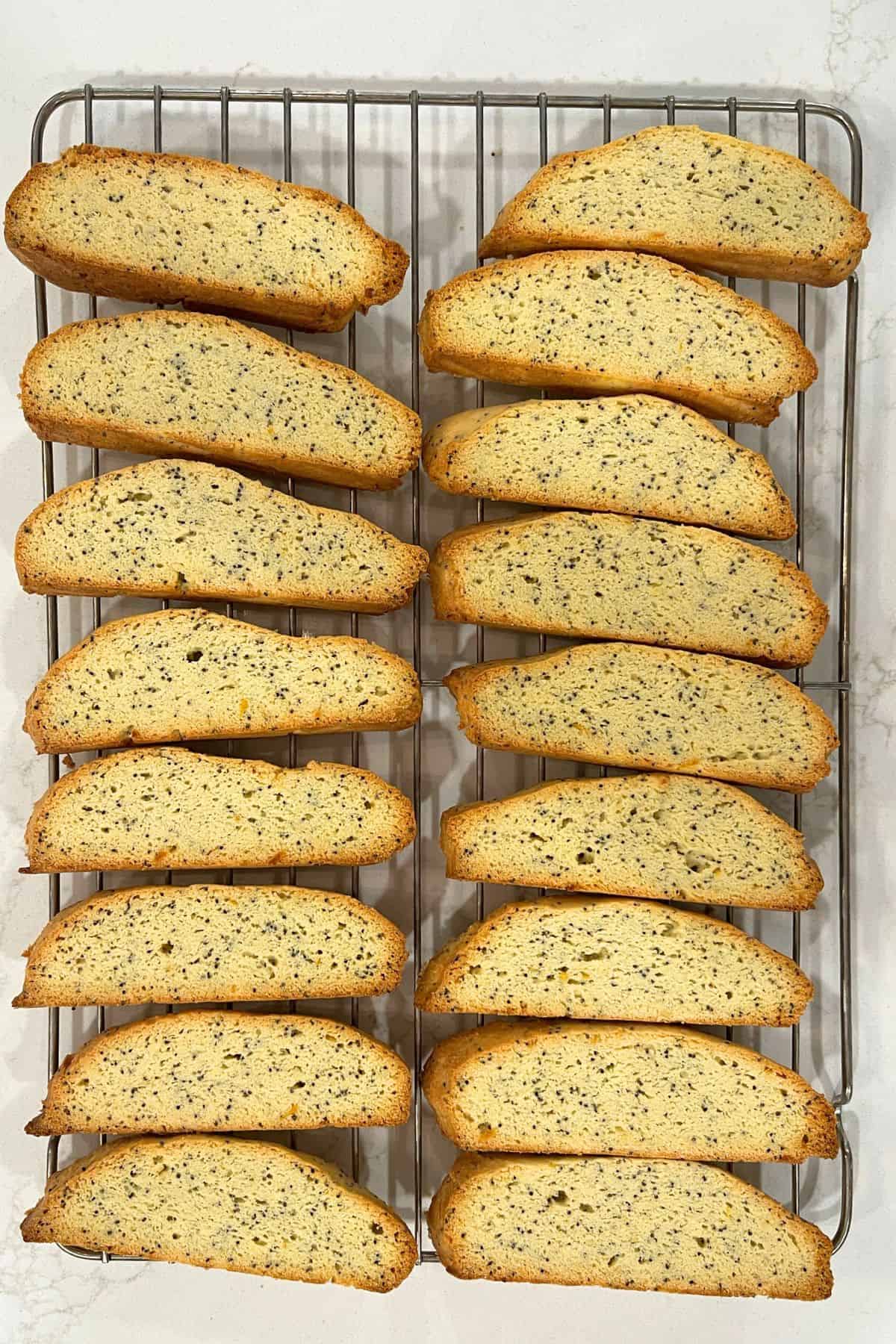 golden-edged biscotti cooling on a wire rack.